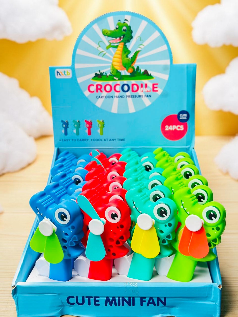 Miso station cartoon crocodile hand pressure mini fans in blue, red, and green displayed in a retail box.