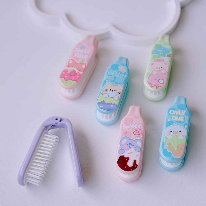 Miso station portable folding hair brushes in pastel colors with cute kawaii character designs and flexible bristles.