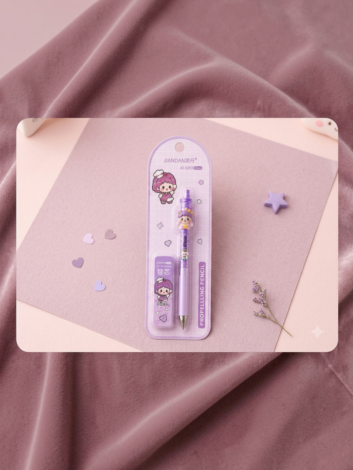 Miso station purple kawaii muppet doll mechanical pencil with matching lead refill case on a soft pink background.