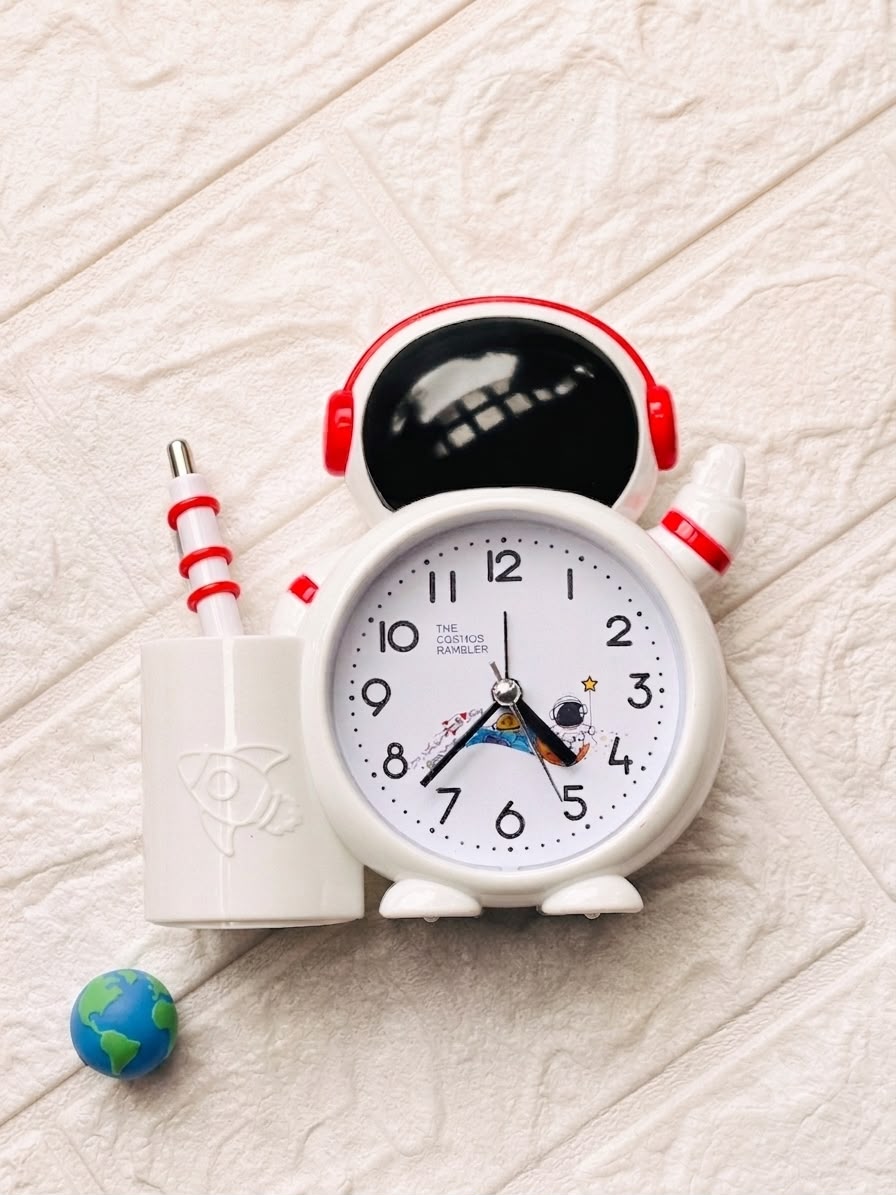 Astronaut alarm clock with pen holder