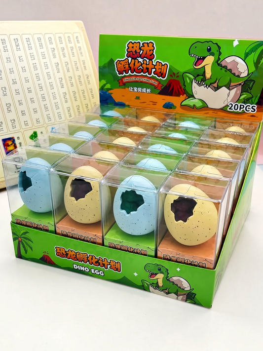 Miso station dino egg erasers in blue and yellow speckled shells, displayed in a 20-piece retail box.