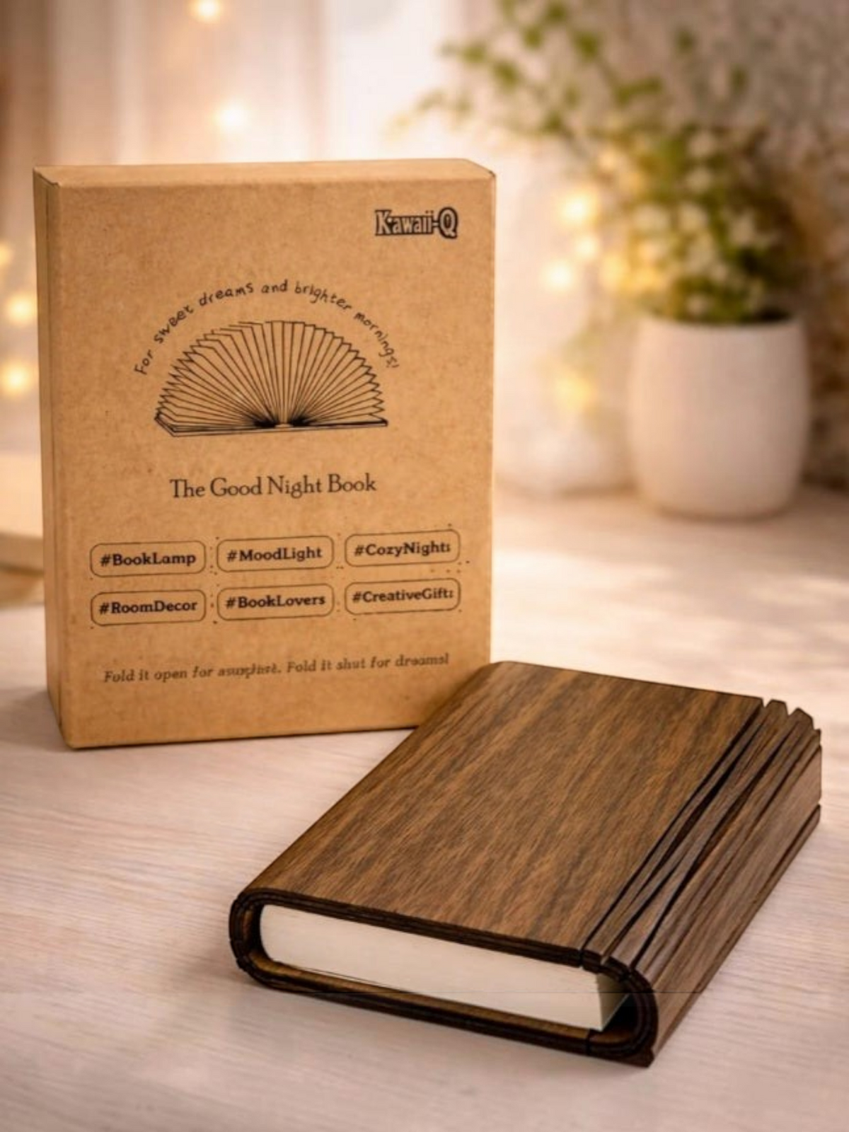 Miso station rechargeable book lamp with a dark wood grain cover sitting in front of its branded cardboard box