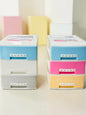 Miso station 3-tier plastic desktop storage drawers in pastel blue, pink, yellow, white, and grey for desk organization.