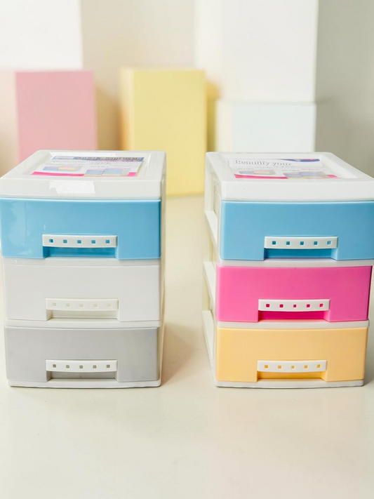 Miso station 3-tier plastic desktop storage drawers in pastel blue, pink, yellow, white, and grey for desk organization.