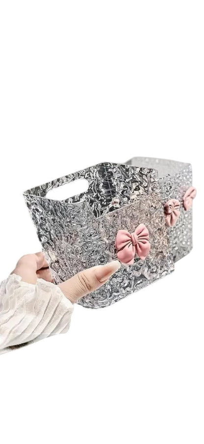Miso station clear acrylic bathroom organizer with textured glass finish and a decorative pastel pink bow accent.