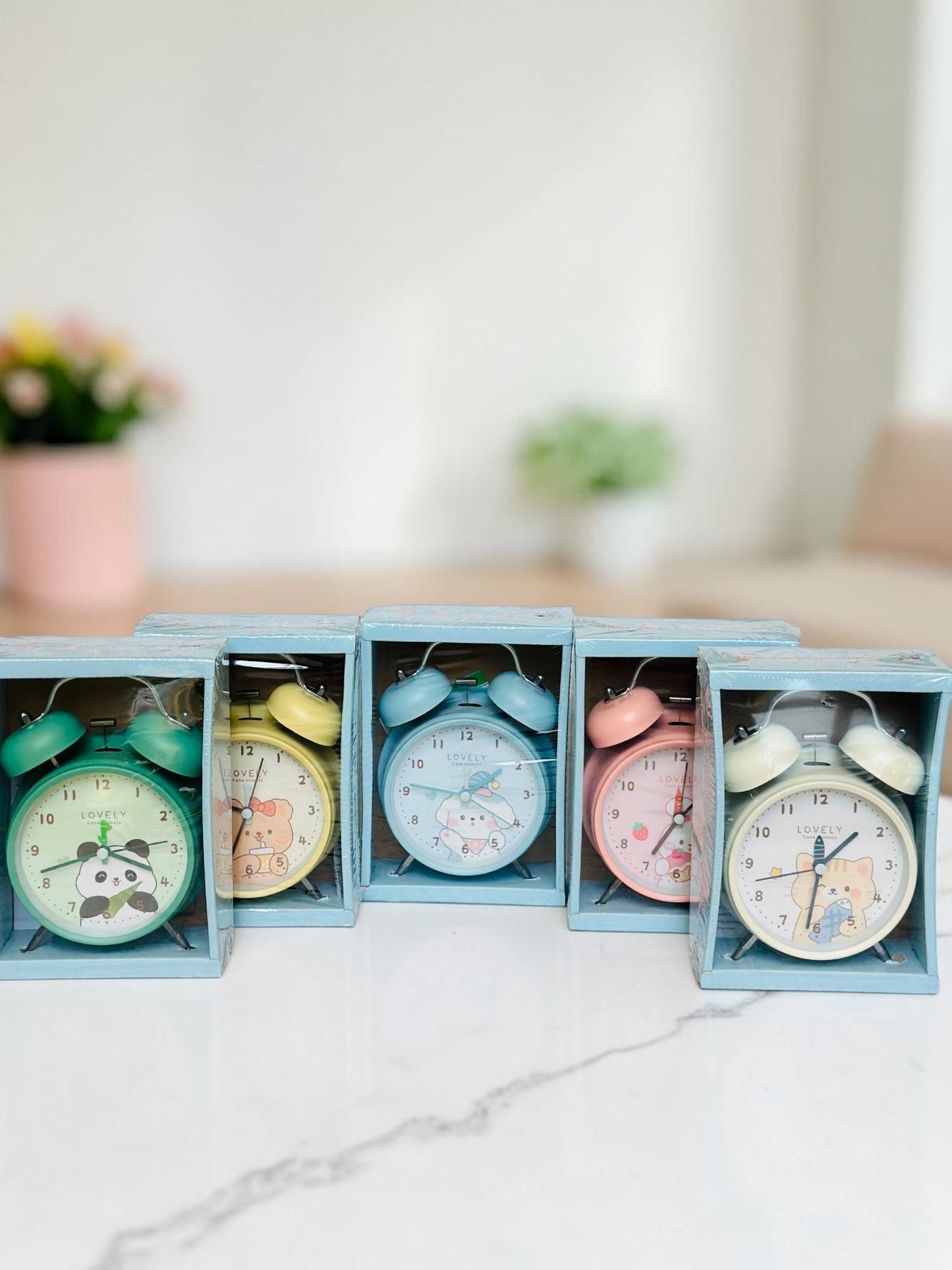 Miso station collection of five pastel twin-bell analog alarm clocks with cute animal illustrations in boxes