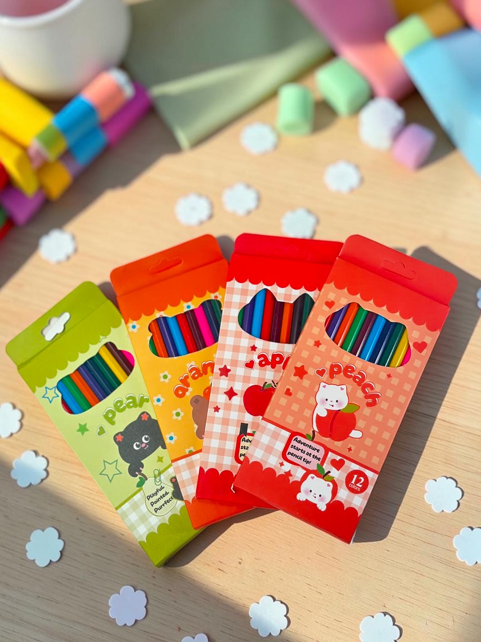 Miso station set of 12 vibrant colored pencils in fruit and animal themed boxes, perfect for art and school projects.