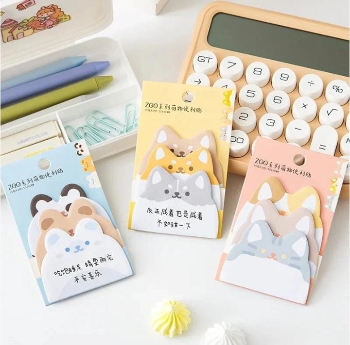 Miso station animal shaped sticky note pads featuring cute cat and dog designs on a desk with office supplies