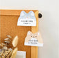 Miso station cat and dog shaped adhesive memo pads stuck to a cork board for desk organization