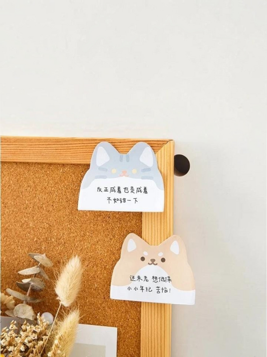 Miso station cat and dog shaped adhesive memo pads stuck to a cork board for desk organization