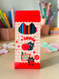 Miso station 12-piece colored pencil set in a red apple-themed box featuring cute black cat illustrations.