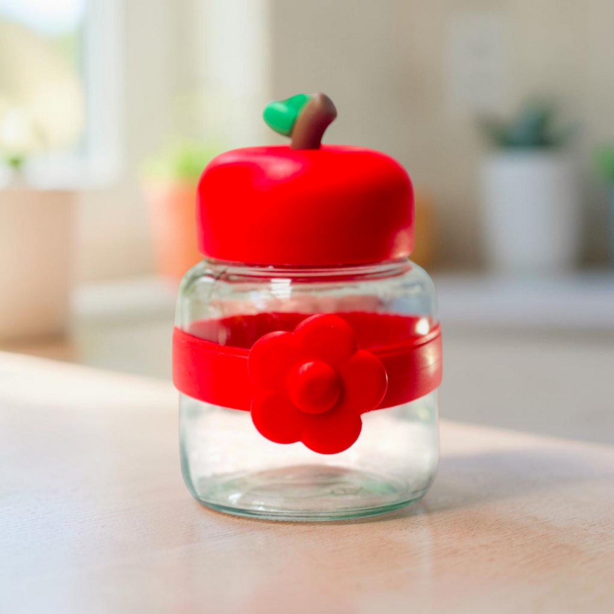 Miso station apple-shaped glass storage jar with a red lid, green stem, and a red silicone band with a flower motif.