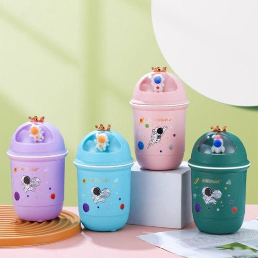 Miso station astronaut themed desktop storage bins in purple, blue, pink, and green with crown and dome lid details.
