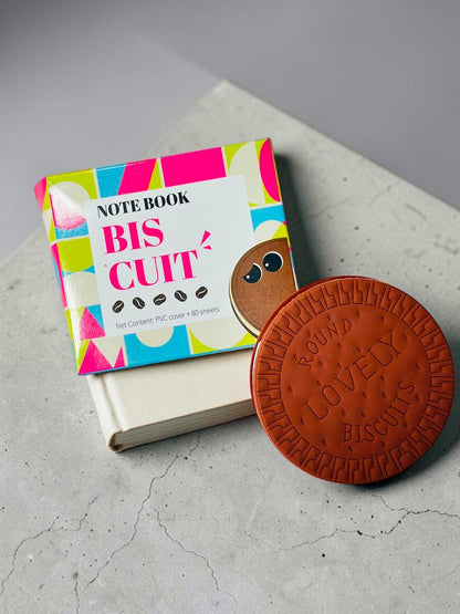 Miso station round biscuit-shaped notebook with textured brown PVC cover and colourful geometric packaging