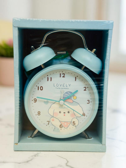 Miso station pastel blue twin-bell analog alarm clock featuring a cute puppy illustration on the dial in packaging