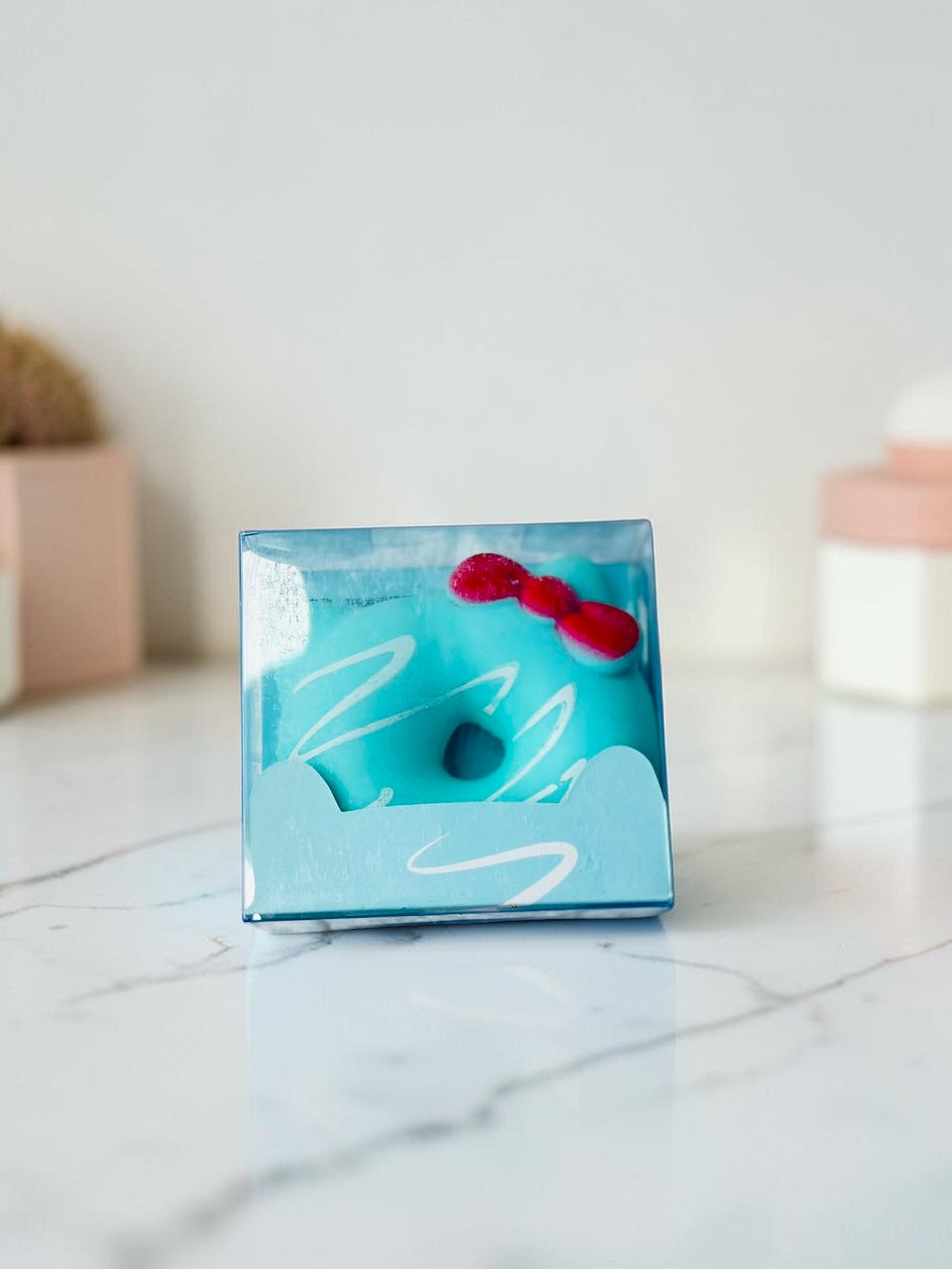 Miso station blue cat ear donut stress relief squeeze toy in clear packaging with a red bow detail