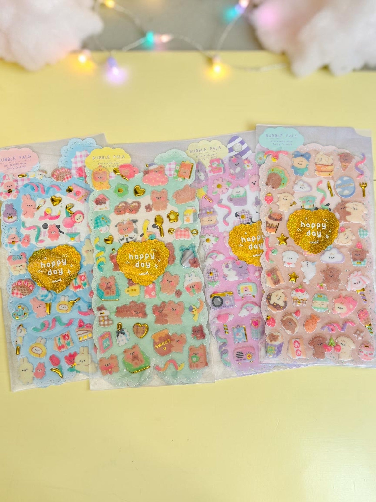 Miso station Bubble Pals puffy sticker sheets with cute animals, sweet treats, and glittery gold heart accents.