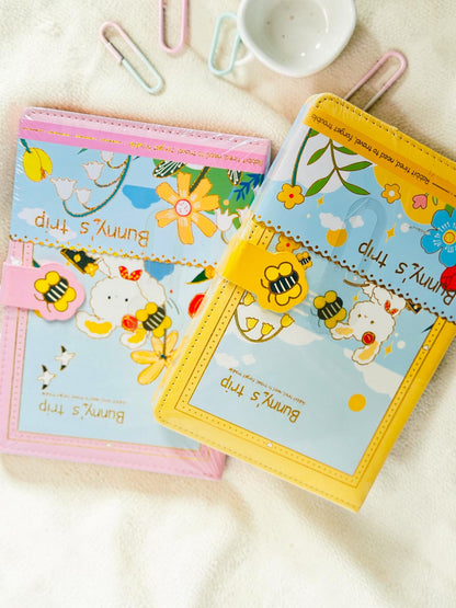 Miso station Bunny Trip journals in pink and yellow with whimsical bunny illustrations and bee magnetic clasps.