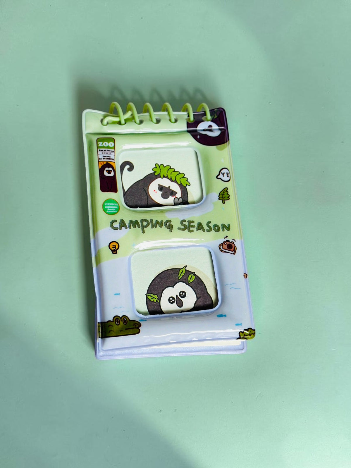 Miso station Camping Season spiral-bound pocket notebook featuring cute animal illustrations on a green cover.