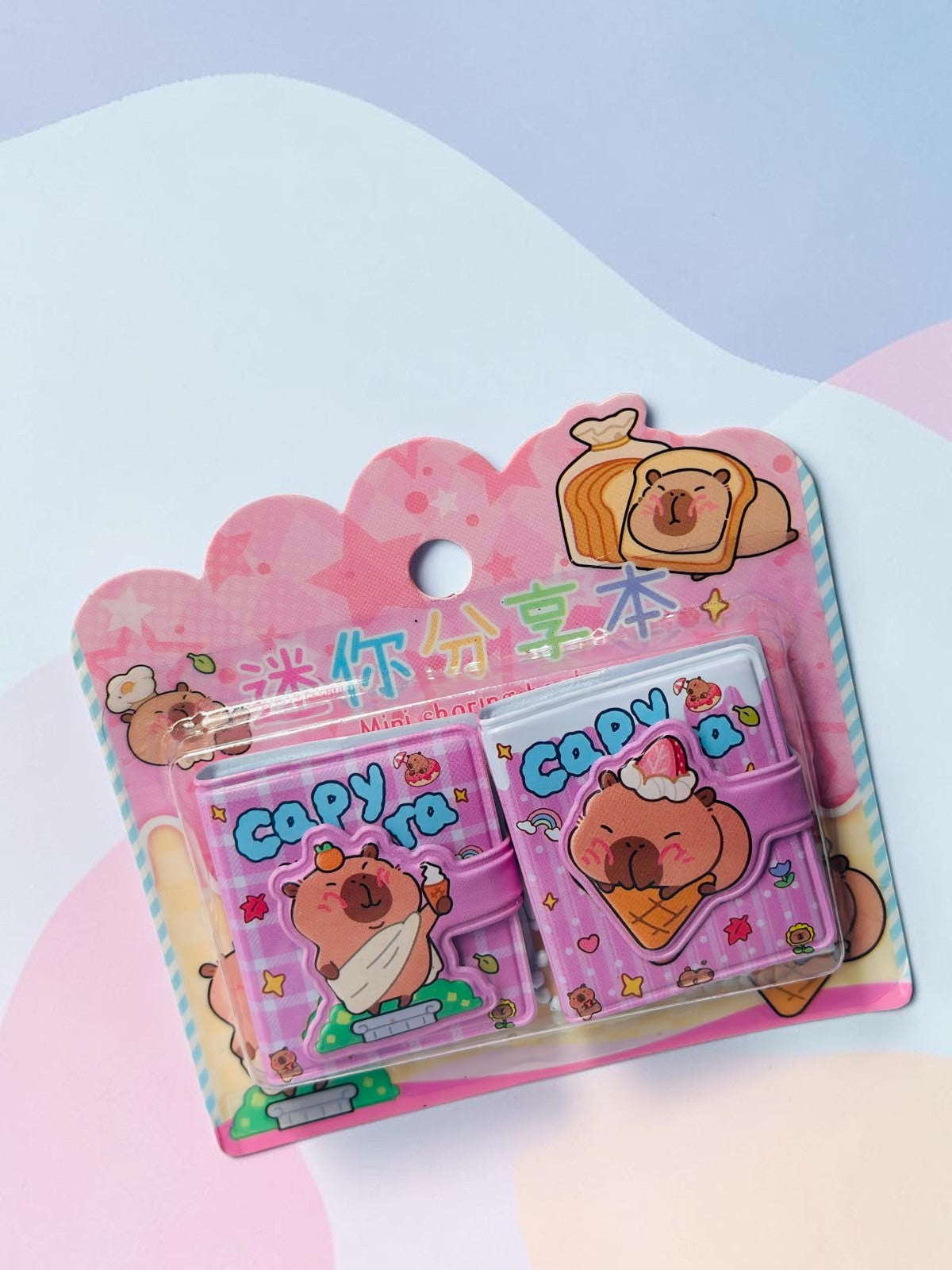 Miso station capybara themed mini notebook set in pink with cute food illustrations and secure strap closures