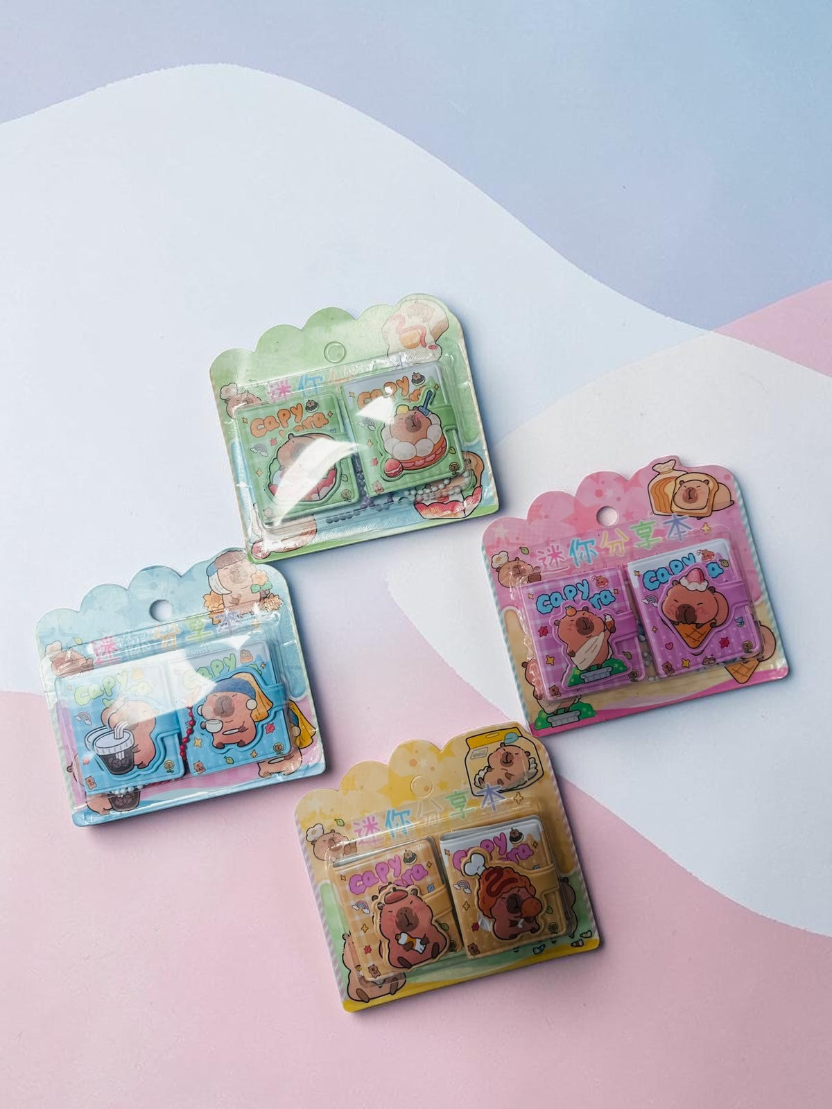 Miso station capybara themed mini notebook sets in four vibrant colors with cute food illustrations in packaging.