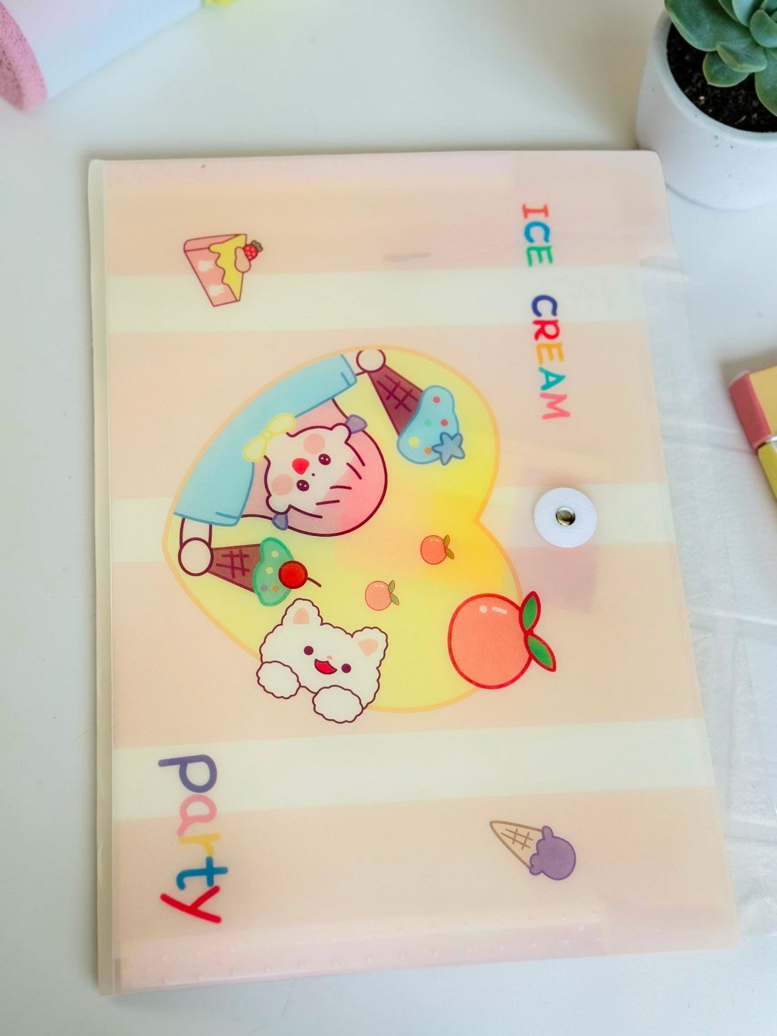 Miso station A4 document folder in frosted plastic with a cute cartoon girl, bear, and ice cream party illustration.