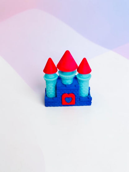Miso station castle shaped eraser in blue and light blue with bright pink conical roofs and a red heart accent