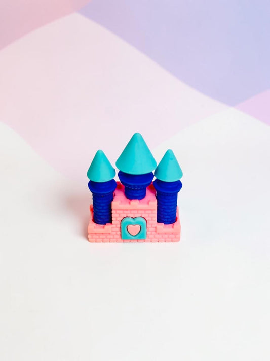 Miso station castle shaped eraser in pink, blue, and teal with a heart accent on a pastel background