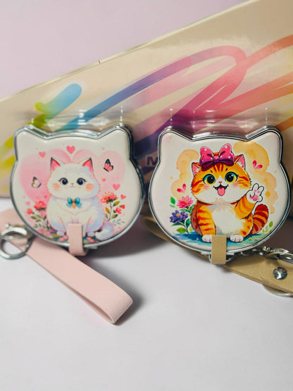 Miso station cat shaped compact mirrors with kitten illustrations, wrist straps, and keychain attachments.