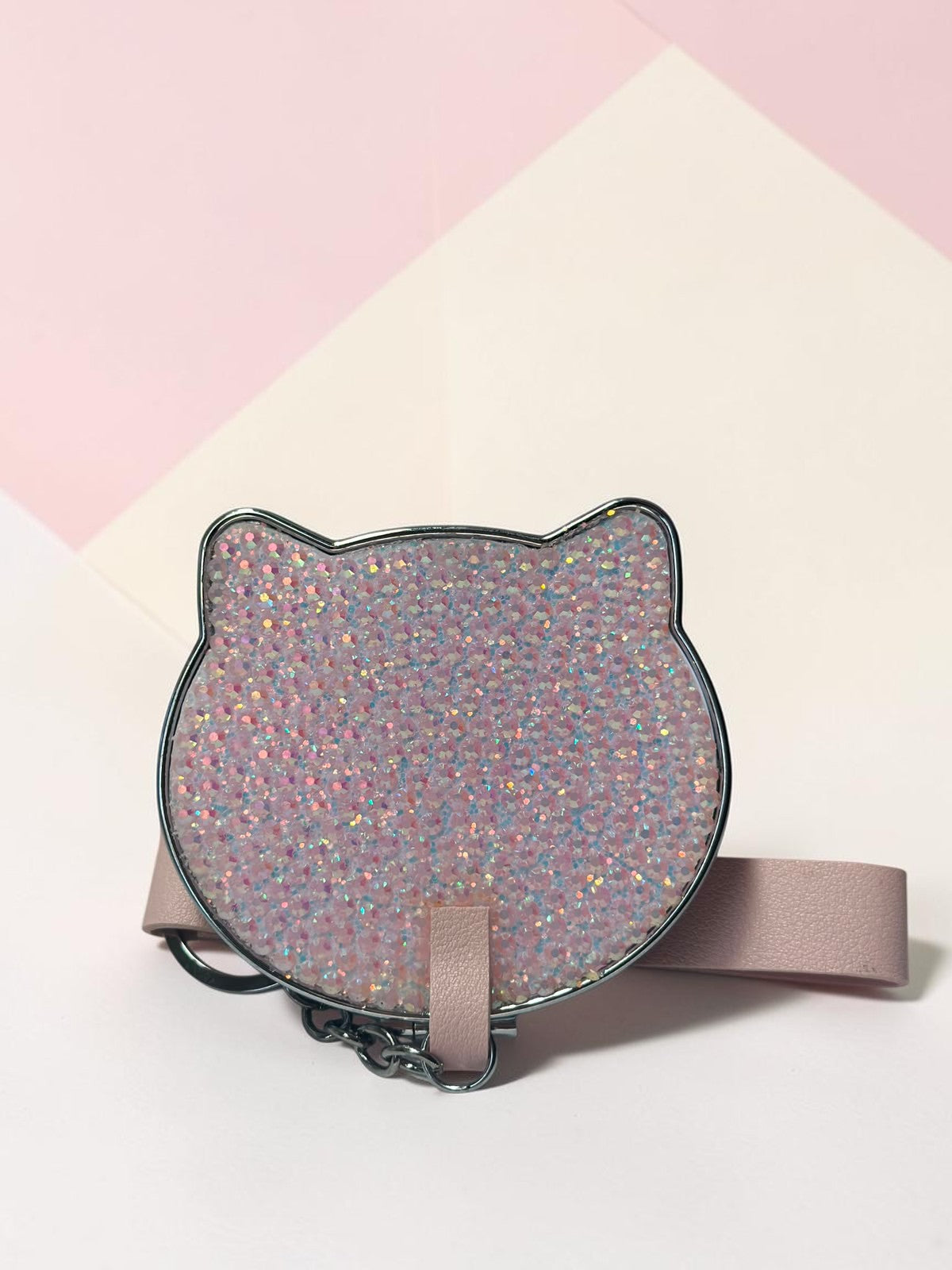 Miso station cat-shaped compact mirror with a pink glitter finish, metallic edge, and a matching wrist strap.