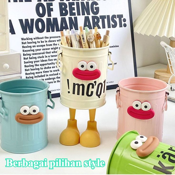 Miso station whimsical character pen holders in cream, light blue, pink, and green with expressive faces and legs.