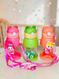 Miso station character themed water bottles in pink, green, and coral with 3D animal accents and adjustable straps.