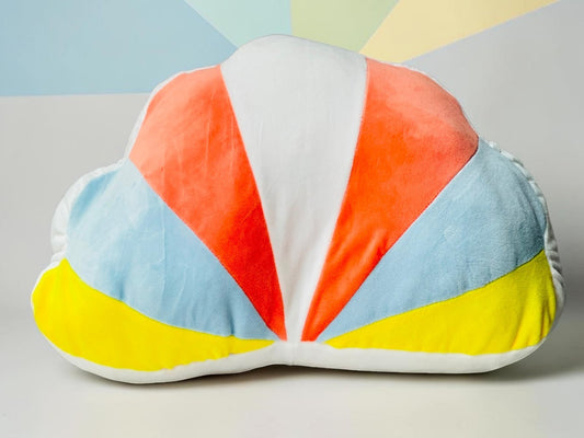 Miso station plush cloud-shaped throw pillow with a vibrant orange, blue, and yellow sunburst pattern on white fabric.