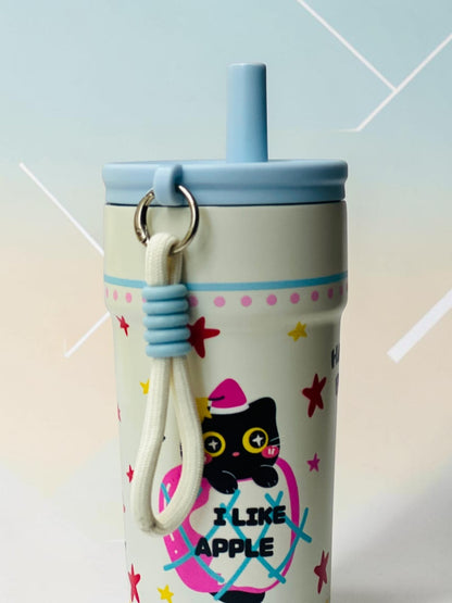 Miso station cream insulated tumbler with a black cat in apple graphic, blue lid, straw, and carrying strap.