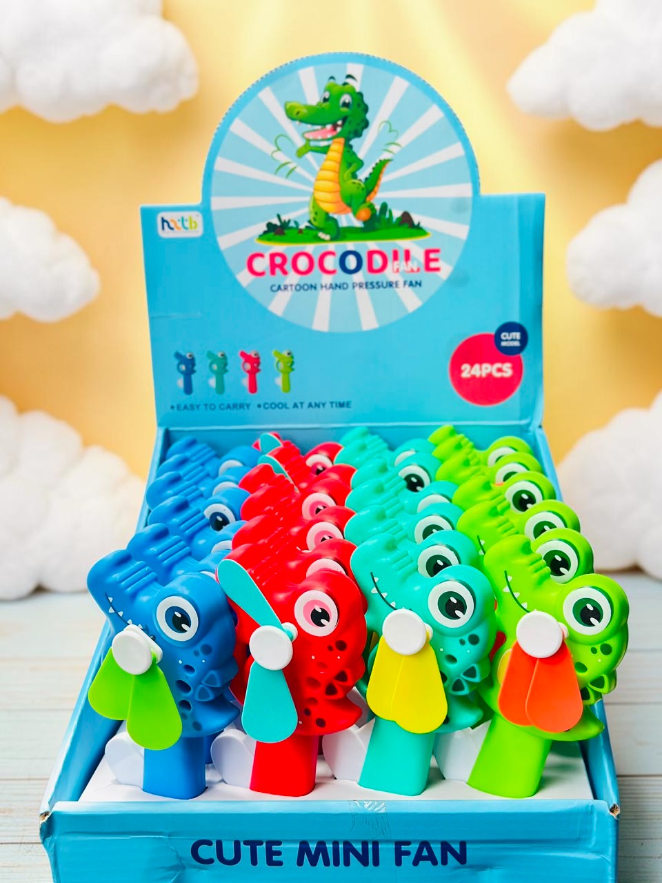 Miso station cartoon crocodile hand pressure mini fans in blue, red, and green displayed in a retail box