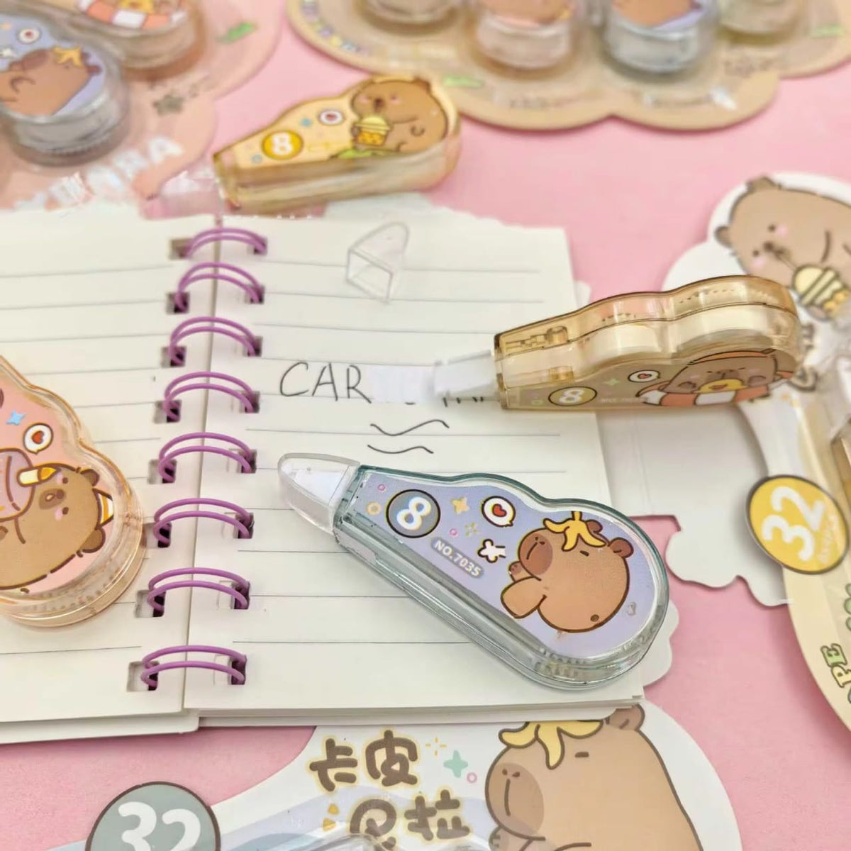 Miso station cute cartoon bear correction tape roller being used on a spiral notebook page