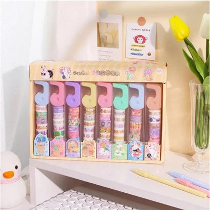 Miso station decorative washi tape set with colorful patterned rolls and a convenient plastic dispenser on a desk.