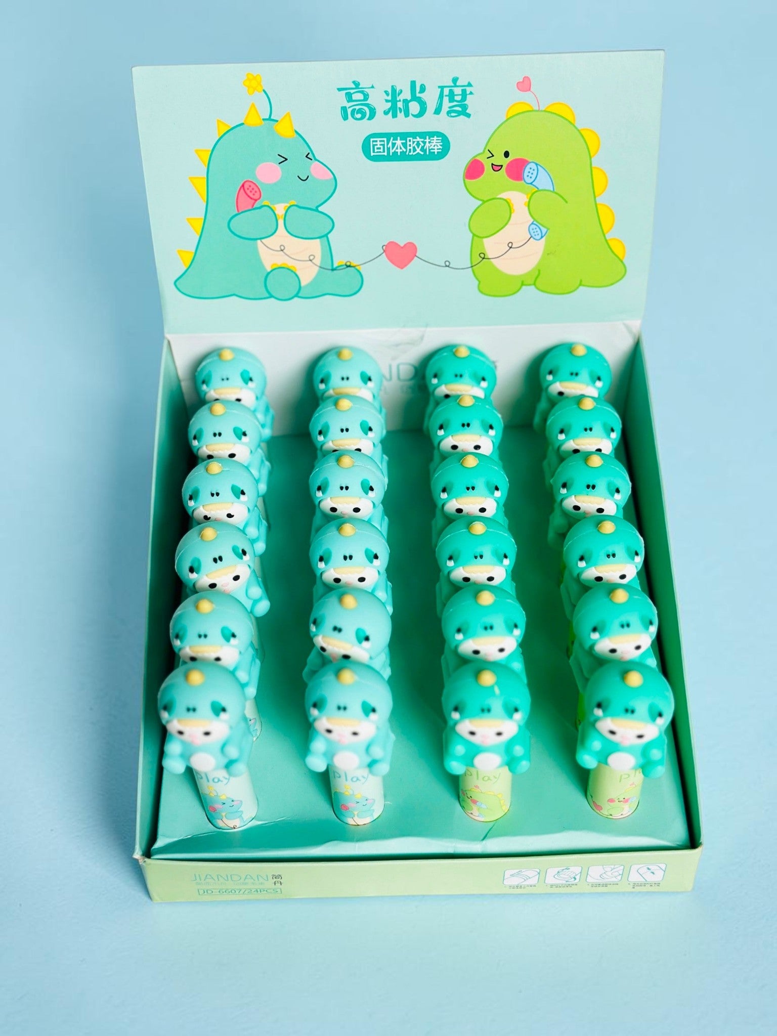 Miso station dinosaur character adhesive glue stick set in a display box with cute green dinosaur toppers