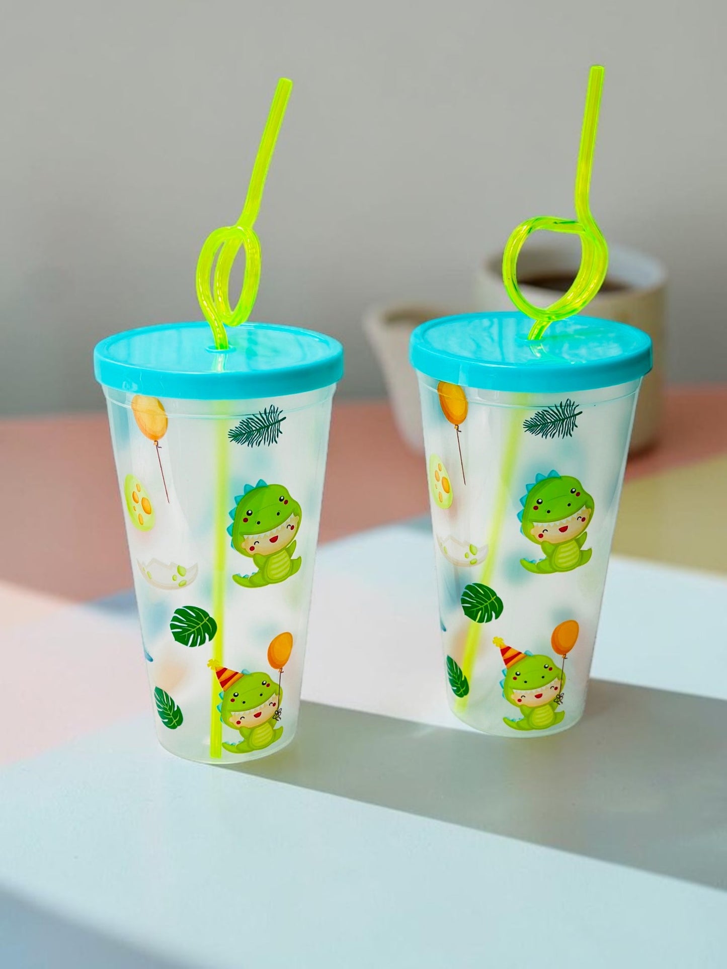 Miso station dinosaur themed plastic tumblers with blue lids and lime green curly straws for kids
