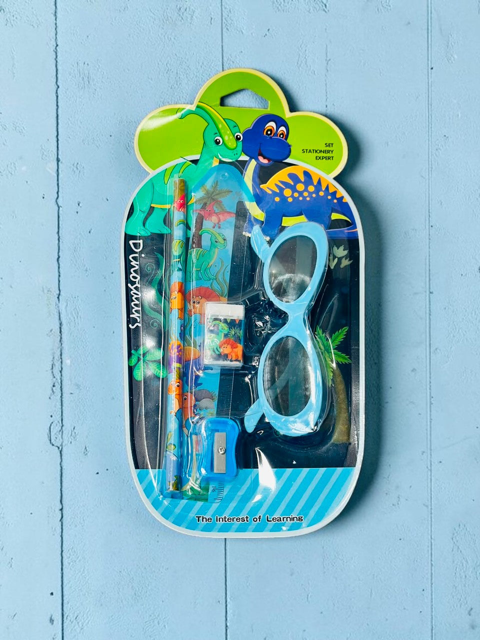 Miso station dinosaur themed stationery set including a pencil, sharpener, eraser, ruler, and light blue novelty glasses