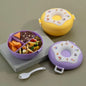 Miso station donut-shaped bento lunch boxes in yellow and purple with compartments, utensils, and playful decals.