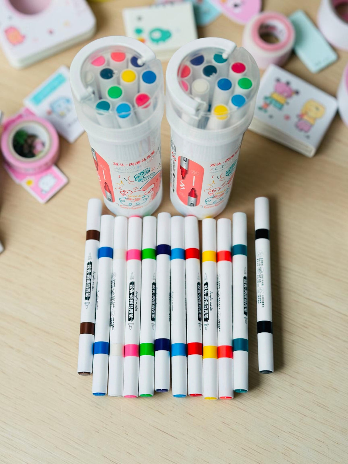 Miso station dual tip acrylic marker set with vibrant pens and two portable storage cases on a white brick background