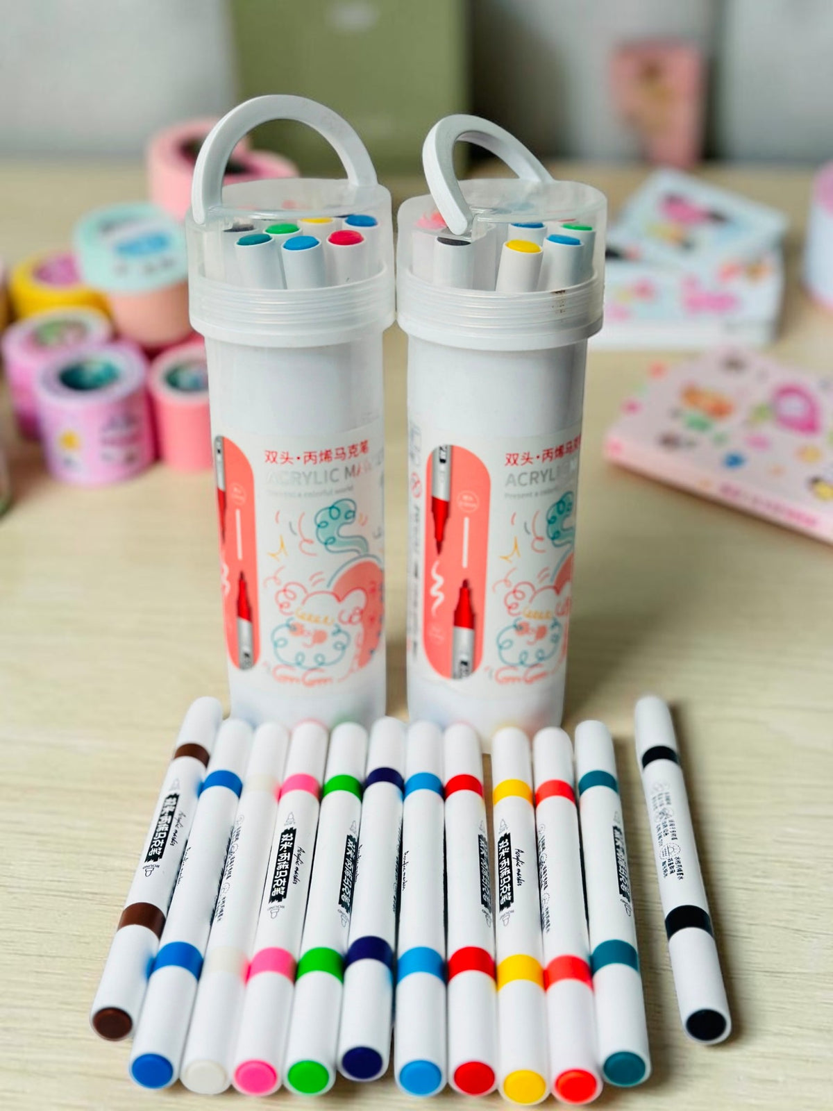 Miso station dual tip acrylic marker set with two white carrying cases and assorted colorful pens on white surface