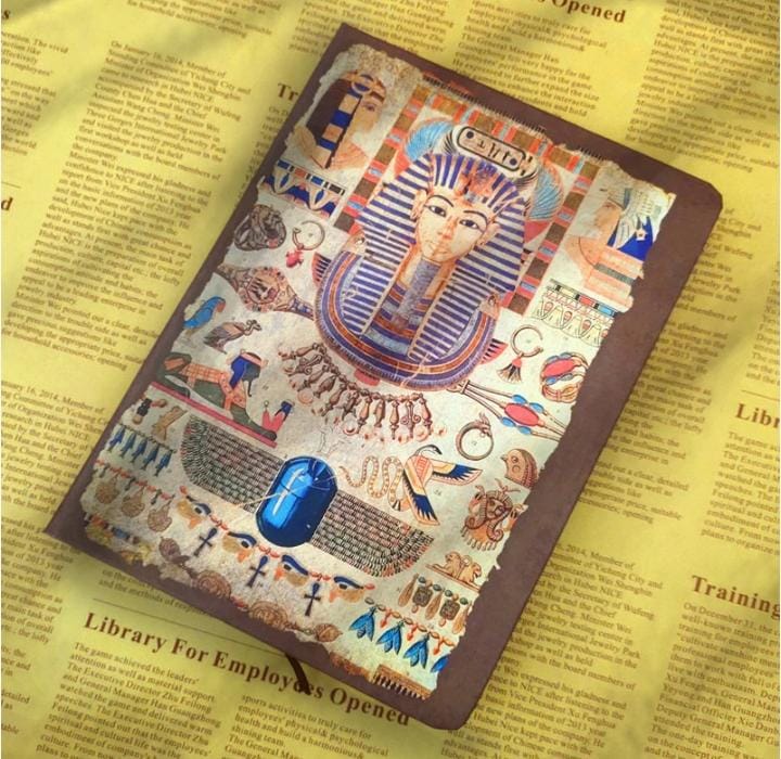 Miso station Ancient Egyptian themed journal with Tutankhamun mask cover and hieroglyphics on a newspaper background