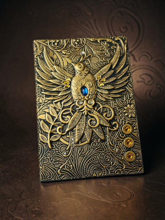 Miso station vintage-style journal with an intricately embossed gold bird motif and shimmering faux gemstone accents.
