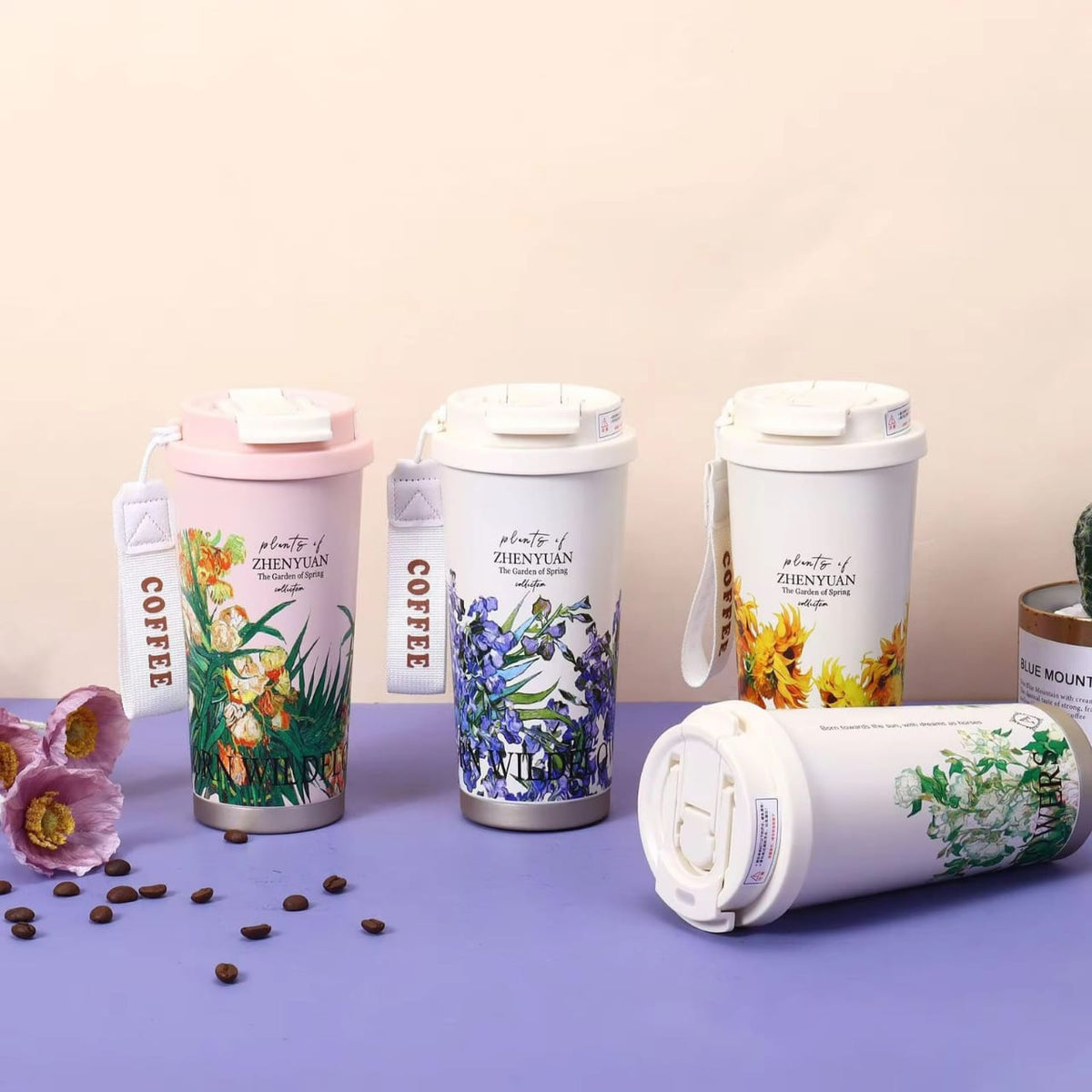 Miso station floral insulated travel tumblers with botanical illustrations, leak-resistant lids, and carrying straps.