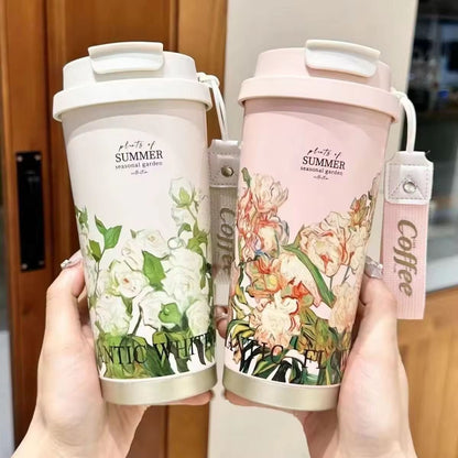 Miso station insulated travel tumblers in white and pink with floral botanical prints and carrying straps.