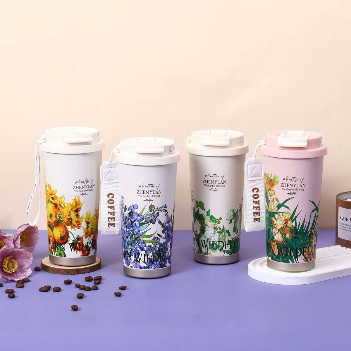 Miso station insulated travel tumblers with floral botanical patterns, stainless steel construction, and carry straps.