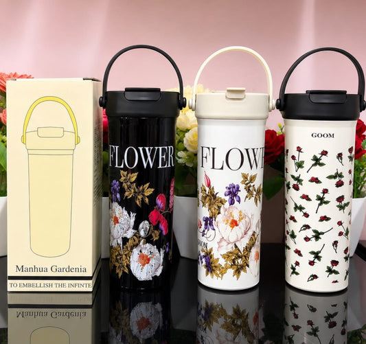 Miso station insulated stainless steel tumblers with floral patterns, carry handles, and lids in black and cream.
