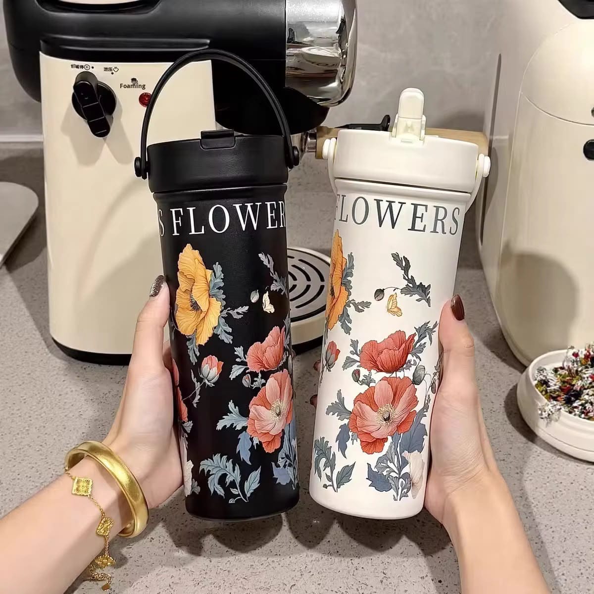 Miso station floral pattern insulated stainless steel tumblers in black and cream with carry handles and straws